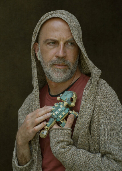 Photograph Larisa Usmanova Portrait Of A Man With A Baby Dinosaur on One Eyeland